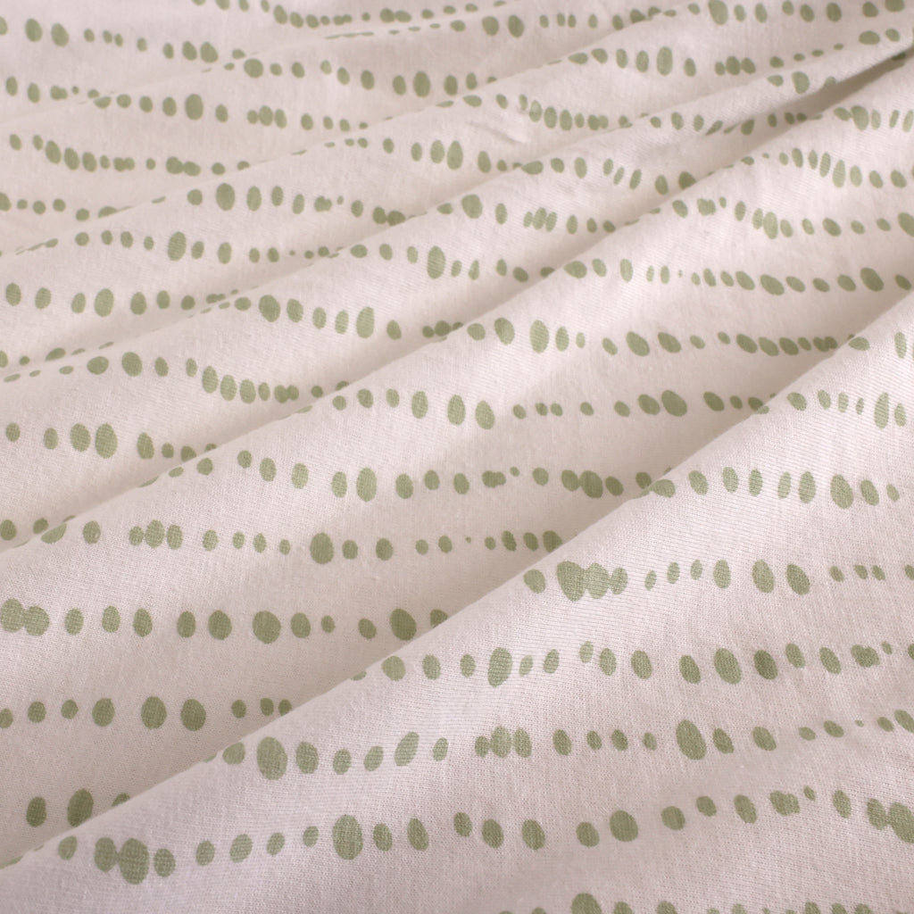 Jersey Fitted Crib Sheet, Green Dot close up