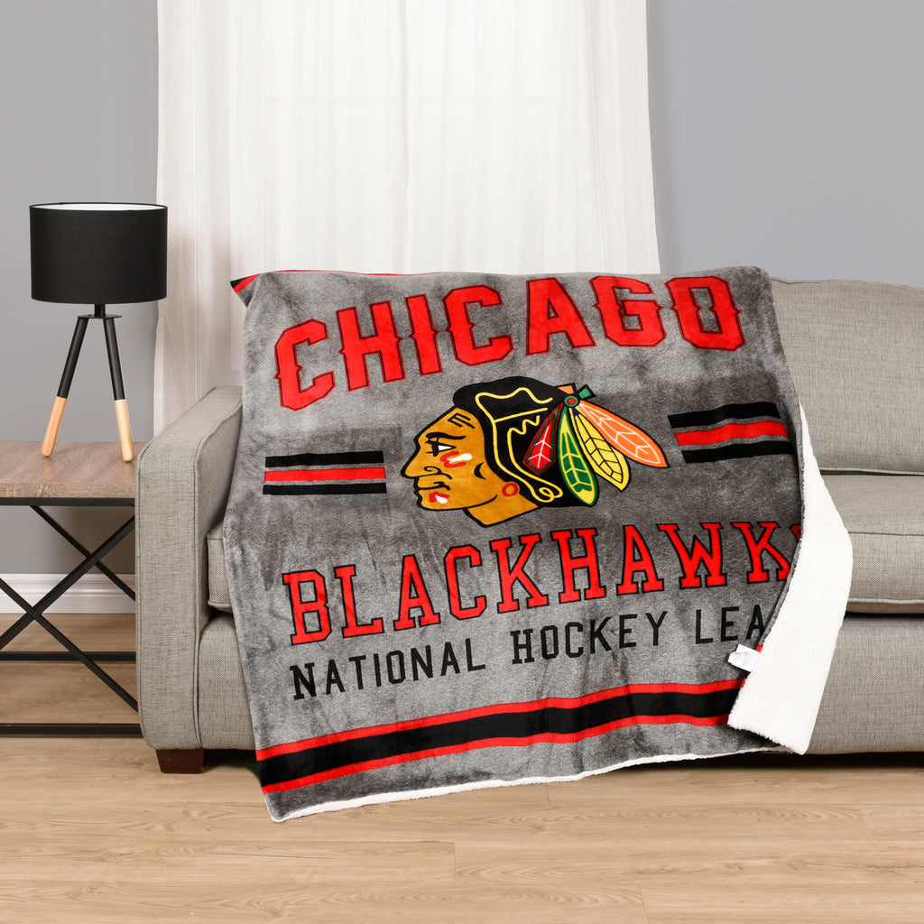 Chicago Blackhawks Superlux Throw room shot on couch