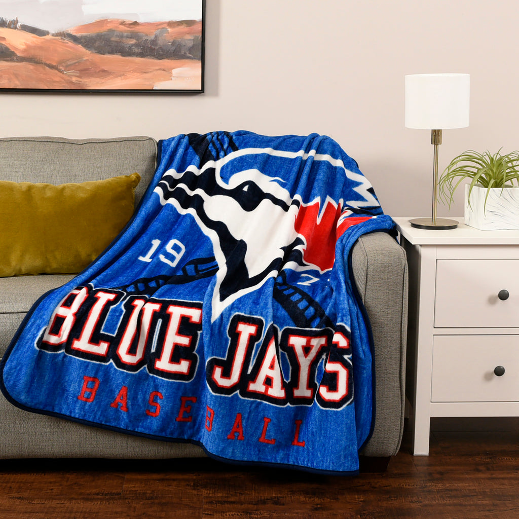 MLB Toronto Blue Jays Plush Throw room shot on couch